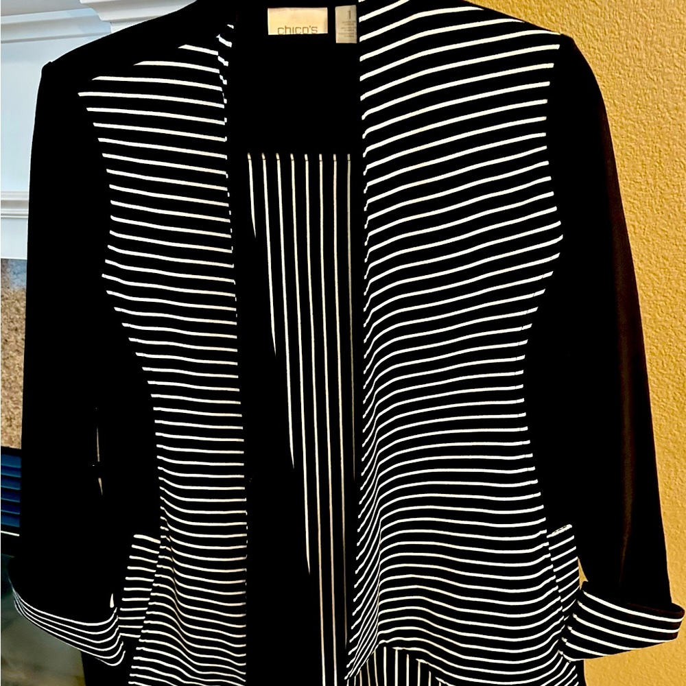 Chicos, size 1 black & white jacket. Silver zipper on the back. Barely worn.